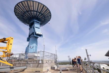 Visitors on a tour view the iconic blue satellite dish on the roof of the Elvey Building, home of the Geophysical Institute. GI/UAF photo by Bryan Whitten